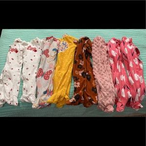 8 Carter’s Sleep & Play outfits. 7 are by Carter’s.